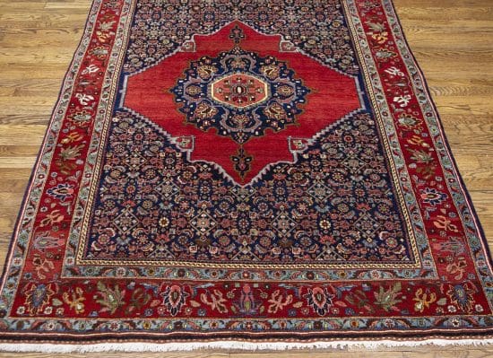 Handmade antique Persian Senneh rug, geometric and floral pattern with terracotta and navy-blue colors. Size 4.8x7.2.
