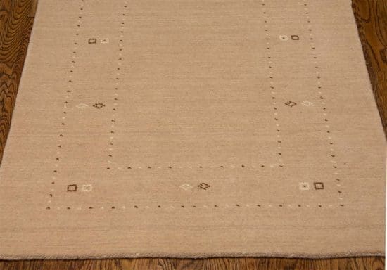 Hand loomed contemporary Gabbeh style wool area rug in beige color. Rug size 3.2x5.