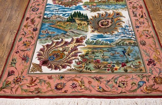 A hand-woven multicolor masterpiece Persian Tabriz rug featuring a nature scene with birds and animals. Size 5x8.5.