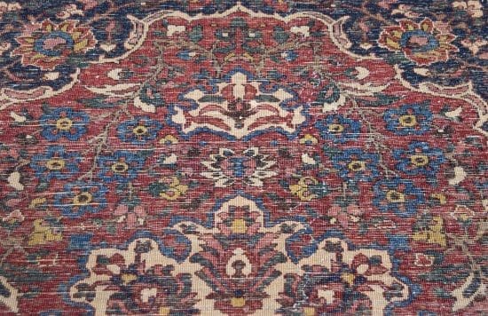 Vintage Persian Bakhtiari wool rug with terracotta and blue colors. Rug size 4.8x6.8.