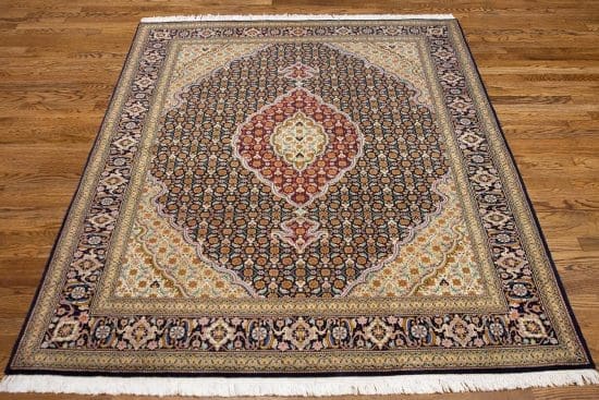 Handmade Persian Tabriz classic style area rug in black and burgundy. Size 5x6.6.